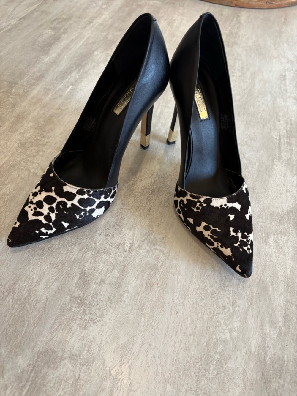 GUESS Black and White Cow Print Pointed Toe Stilettos